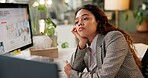 Woman, thinking and tired by computer in office, business consulting and growth at company. Person, analyst and exhausted for deadline with fatigue, burnout or review strategy with overtime at agency