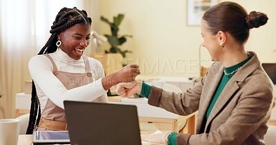 Buy stock photo Business women, fist bump and happy in office with success, support and goals by laptop at startup. People, cheers and smile with partnership, feedback and achievement for project at creative agency