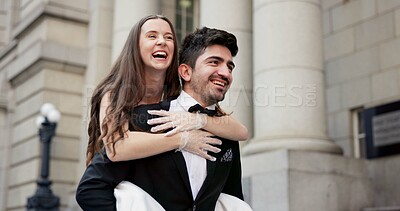 Buy stock photo Happy, couple and piggyback outdoor for wedding celebration, marriage and commitment support. Smile, people and love with affection for partnership, relationship loyalty and romance ceremony at court