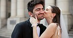 Smile, couple and kiss on cheek for wedding with promise, celebration and marriage commitment. Happy, people and love with affection of partnership, relationship loyalty and romance ceremony at court