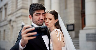 Buy stock photo Couple, selfie and celebration with wedding in city, love or happy for commitment, memory and post on web. People, man and woman for marriage, event or funny face with smile on social media in Greece