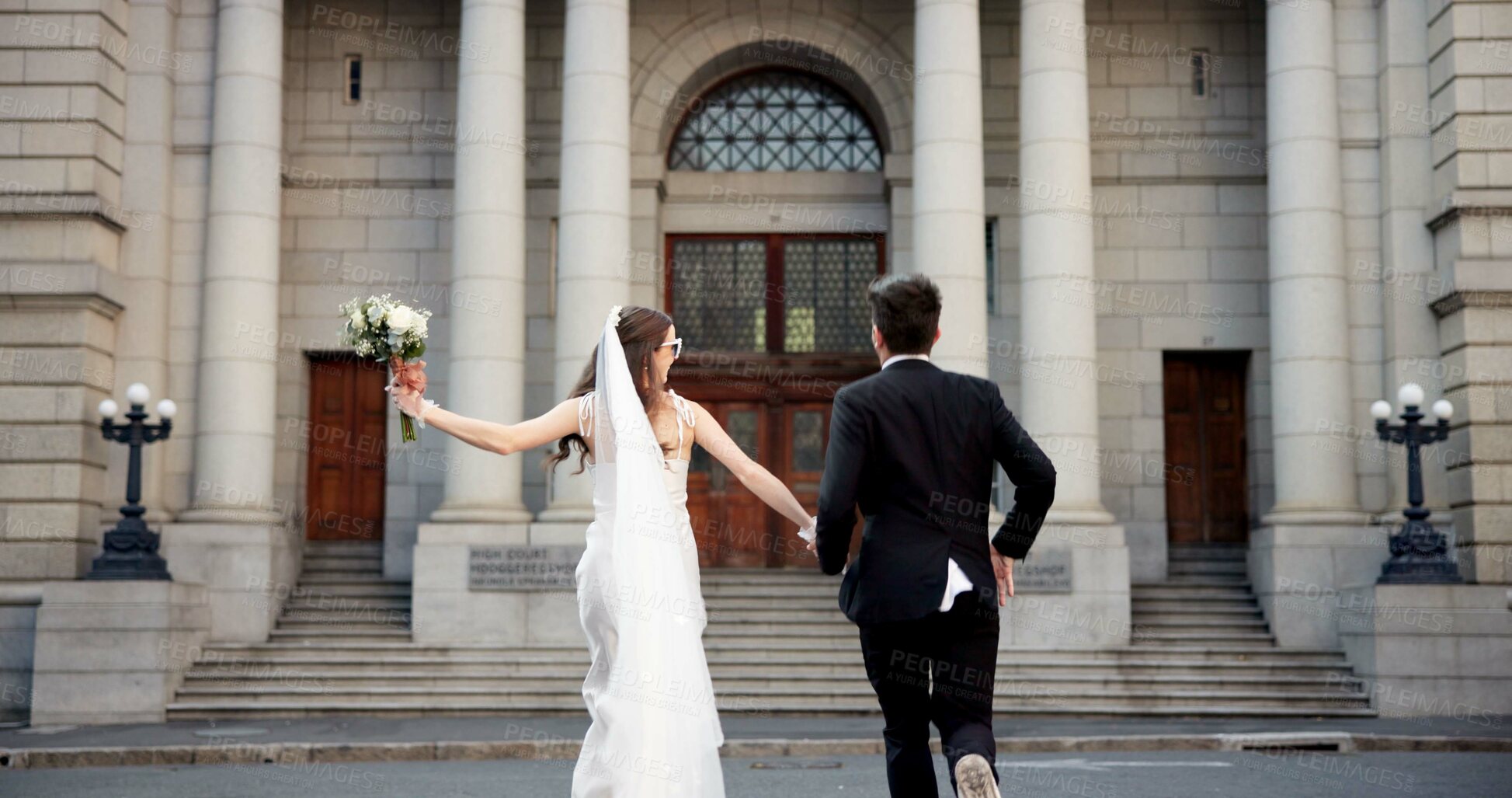 Buy stock photo City, walking and back of couple for wedding at town hall for marriage certificate, ceremony and legal matrimony. Holding hands, love and man and woman at court for commitment, promise or partnership