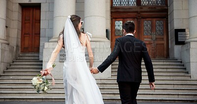 Buy stock photo City, running and back of couple for wedding at town hall for marriage certificate, ceremony and legal matrimony. Holding hands, love and man and woman at court for commitment, promise or partnership