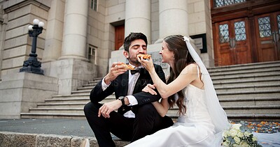 Buy stock photo Couple, wedding and eating pizza in city with smile, feeding and care with celebration, milestone and love. People, man and woman with fast food for marriage, commitment and event by court in Italy