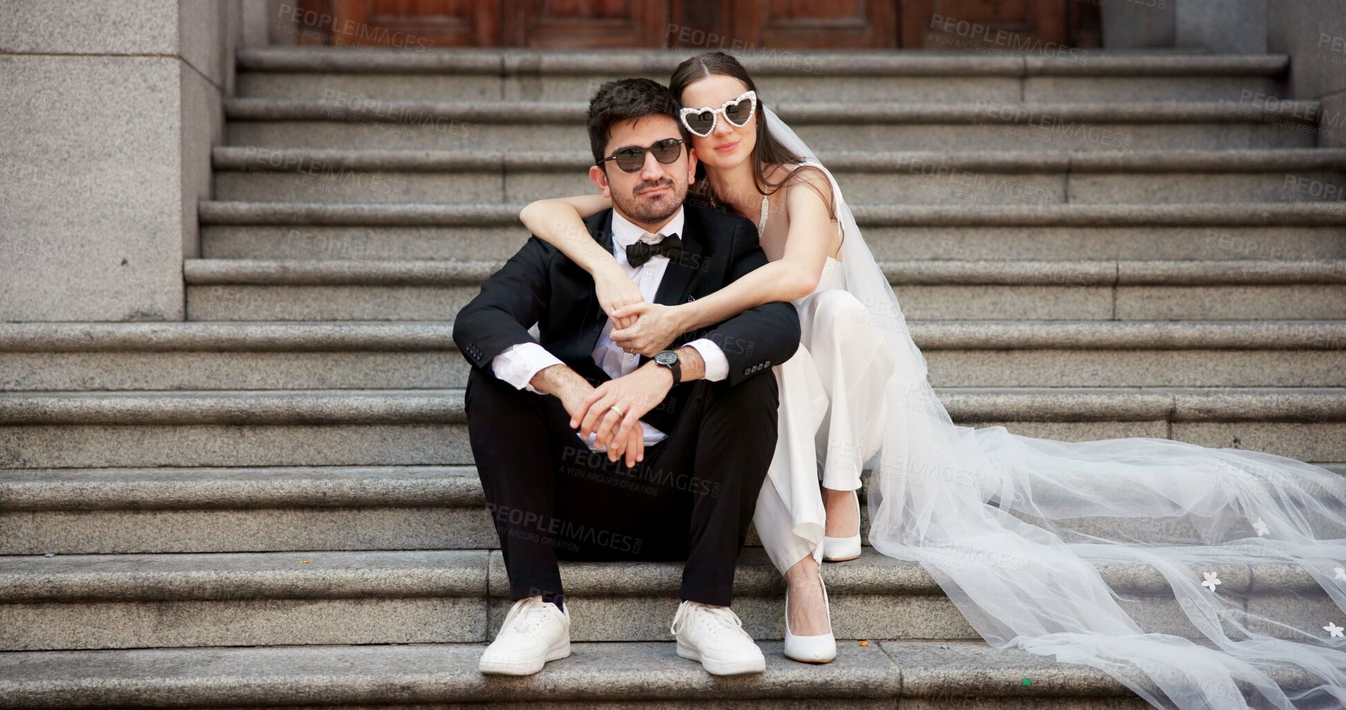 Buy stock photo Wedding, city and couple portrait on steps at courthouse with bride, love and modern fashion for celebration. Sitting, people and marriage event for commitment, loyalty and trust with sunglasses