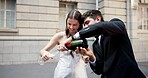 Wedding, happy and couple in city with champagne at ceremony, celebration and commitment. Romance, alcohol toast and man and woman in town for promise, partnership and marriage certificate at court
