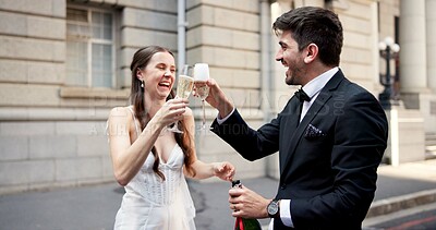 Buy stock photo Wedding, toast and couple in city with champagne at ceremony, celebration and commitment. Romance, alcohol drinks and man and woman in town for promise, partnership and marriage certificate at court