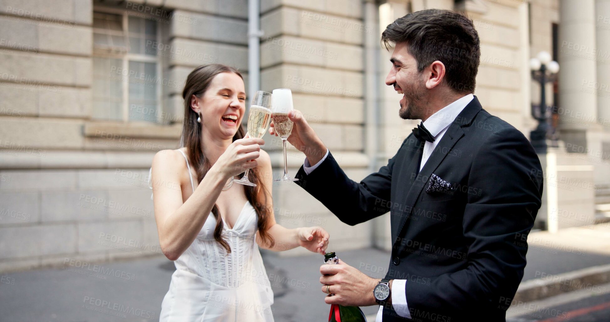 Buy stock photo Wedding, toast and couple in city with champagne at ceremony, celebration and commitment. Romance, alcohol drinks and man and woman in town for promise, partnership and marriage certificate at court