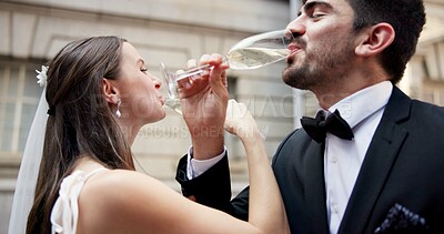 Buy stock photo Wedding, drink and couple in city with champagne at ceremony, celebration and commitment. Romance, alcohol toast and man and woman in town for promise, partnership and marriage certificate at court