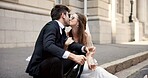 Wedding, kiss and couple in city with alcohol for ceremony, celebration and commitment. Romance, love and man and woman in town with champagne for promise, embrace and marriage certificate at court