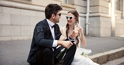 Buy stock photo Wedding, toast and couple in city with alcohol at ceremony, celebration and commitment. Romance, champagne cheers and man and woman in town for honeymoon, partnership and marriage at courthouse