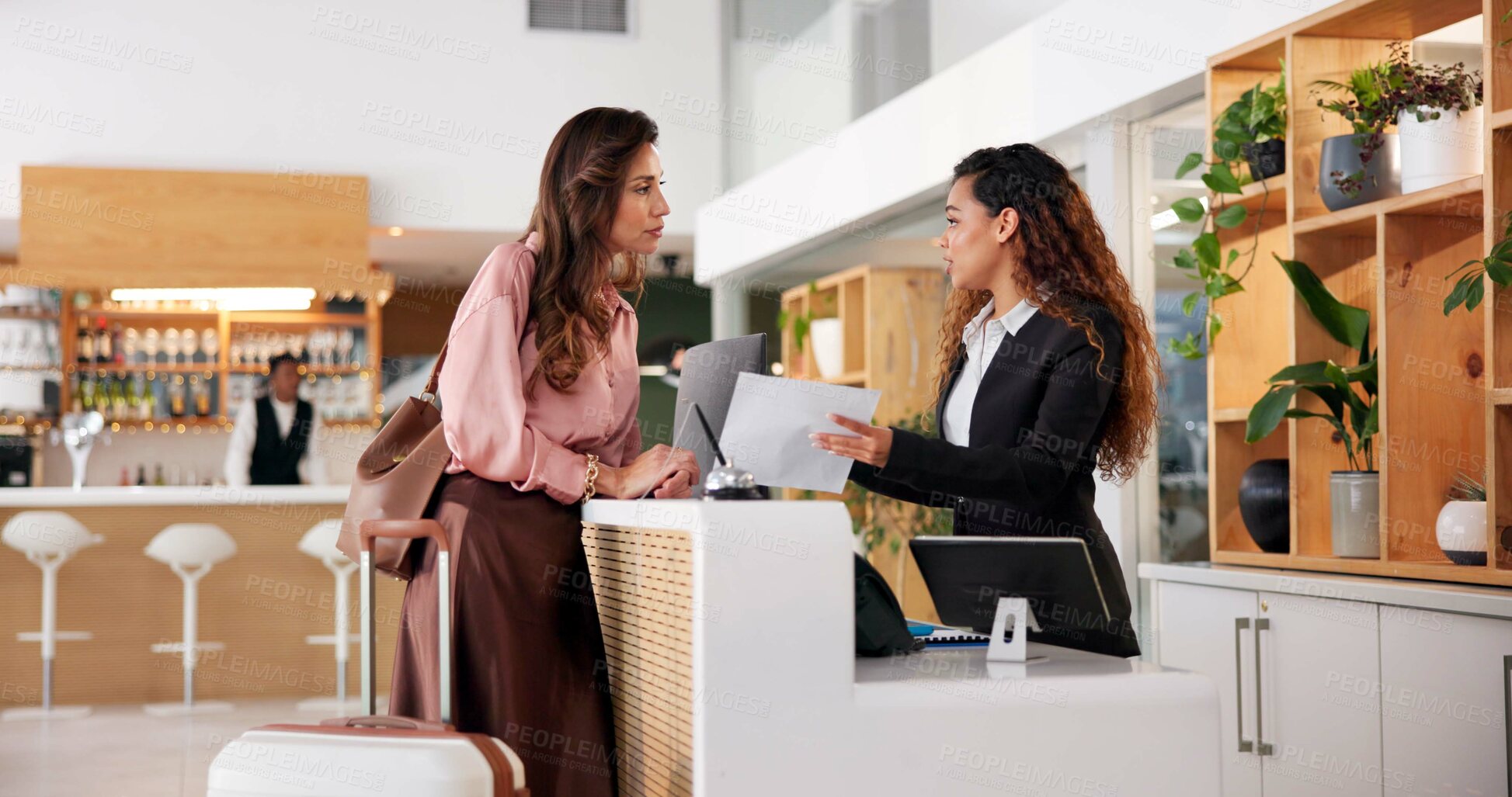 Buy stock photo Hotel, receptionist and woman with paperwork in lobby for booking, guest room service and reservation. Hospitality, front desk and client with concierge with documents for agreement, contract or info