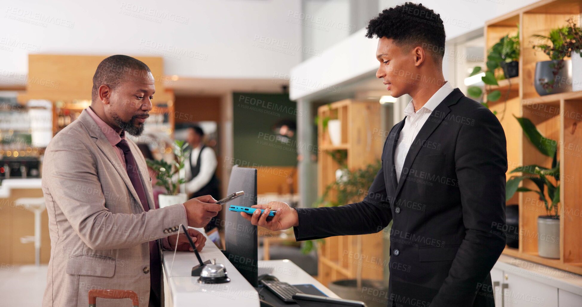 Buy stock photo Hotel, lobby and man with credit card machine for booking, guest room service and reservation. Hospitality, front desk and client with receptionist for pos payment, transaction or purchase with phone