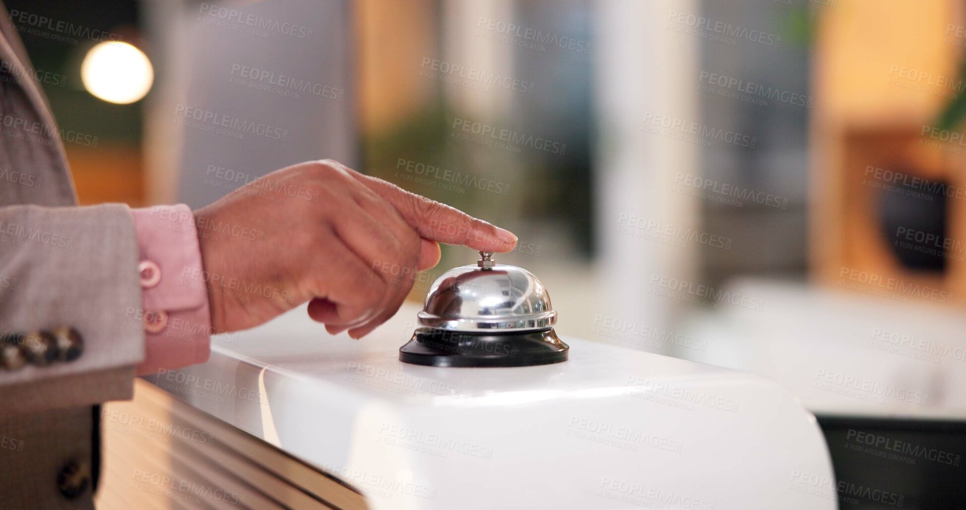 Buy stock photo Hands, hotel and bell ring at reception with waiting for assistance, customer service and concierge help. Hospitality, lobby and booking of person with noise for attention, support and call for staff