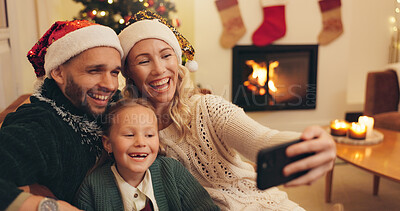 Buy stock photo Christmas, happy and selfie of parents with child in home take photo for profile picture, social media and memory. Love, family and mom, dad and girl smile for festive tradition, holiday and vacation