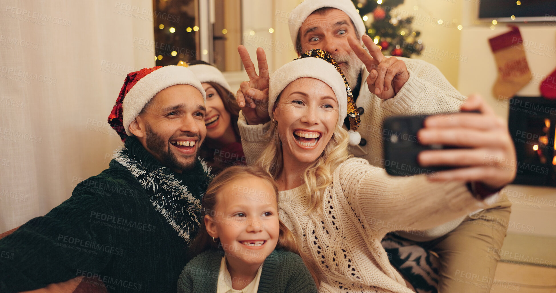 Buy stock photo Selfie of grandparents, parents with child at Christmas for profile picture, social media or memory. Generations, family home and happy mom, dad and girl for festive tradition, holiday and peace sign