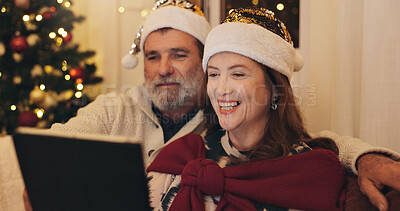 Buy stock photo Couple, smile and relax with tablet on Christmas for online shopping, platform and buying gift. Senior woman, man and happy with tech in living room of home for ecommerce, festive and celebration