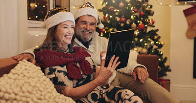Buy stock photo Sofa, happy and couple with tablet on Christmas for online shopping, platform and buying gift together. Man, woman and relax with tech in living room of home for festive, celebration and ecommerce