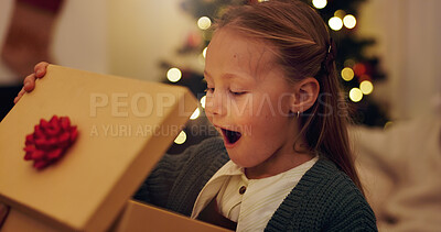 Buy stock photo Happy, surprise and child with gift on Christmas for festive holiday, celebration and present at home. Excited, shocked and little girl with box in living room for December, tradition and gratitude