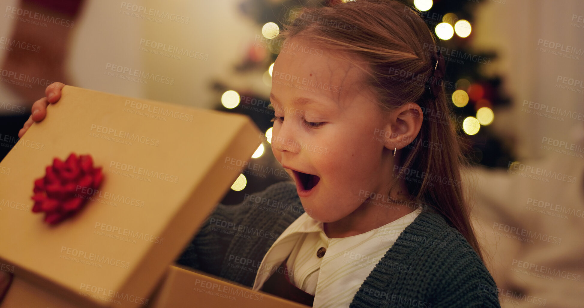 Buy stock photo Happy, surprise and child with gift on Christmas for festive holiday, celebration and present at home. Excited, shocked and little girl with box in living room for December, tradition and gratitude