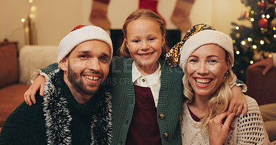 Buy stock photo Christmas, home and portrait of parents with child for festive tradition, holiday and celebration together. Happy, family and mother, father and girl embrace for bonding, excited and fun at party