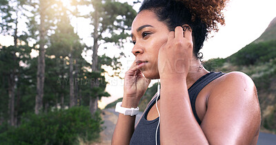 Buy stock photo Woman, runner and earphones in road, nature and perspective with music, break and fitness training in summer. Girl, reflection and streaming for exercise, workout and sound by forest in Costa Rica