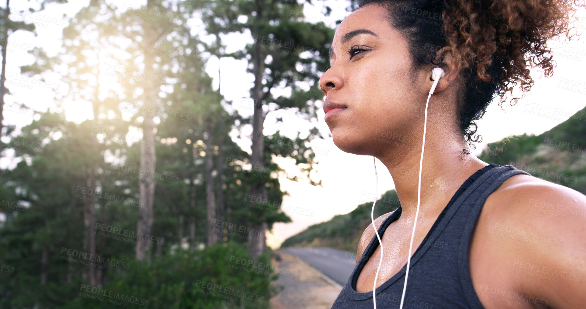 Buy stock photo Girl, runner and earphones in road, outdoor and perspective with music, break and fitness training in summer. Woman, reflection and streaming for exercise, workout and sound by forest in Costa Rica