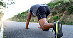 Man, runner and stretching for fitness on mountain road with warm up, start and low angle for training. Person, exercise and training with wellness, health and outdoor for performance in Nigeria