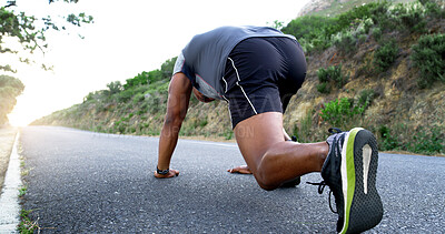Buy stock photo Man, runner and stretching for fitness on mountain road with warm up, start and low angle for training. Person, exercise and training with wellness, health and outdoor for performance in Nigeria