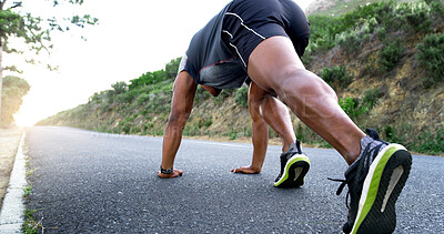 Buy stock photo Man, runner and stretching for exercise on mountain road with warm up, start and low angle with legs. Person, fitness and training with wellness, health and outdoor for performance in Nigeria