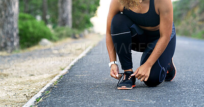 Buy stock photo Hands, runner and shoelace on road, outdoor and ready for training, workout or fitness for health in summer. Person, shoes and start morning with exercise, wellness or nature on asphalt in Costa Rica