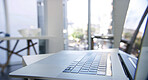 Laptop, keyboard and empty office for online tech, interior and equipment for networking career. Buttons, wireless device and internet connection for website, communication and desk at workplace