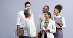 Business people, technology and meeting for advice, teamwork for financial report or taxes review in studio. Mature manager, women and men with digital tech, discussion or planning on gray background