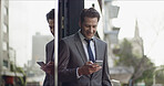 Business, man and smile with phone in city for text message, checking notification or communication. Professional, person or happy with smartphone by outdoor building for mobile chat or reading email