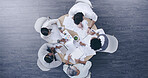 Top view, business people and team meeting, discussion or planning on tablet with paper in creative startup. Group, above and brainstorming ideas in collaboration for project, logo design or strategy