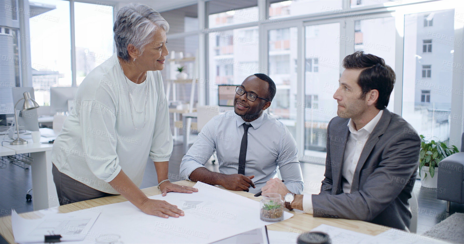Buy stock photo Interior design, business people and team meeting, discussion or planning with paperwork in creative startup. Group, happy manager and brainstorming ideas for construction, renovation or blueprint
