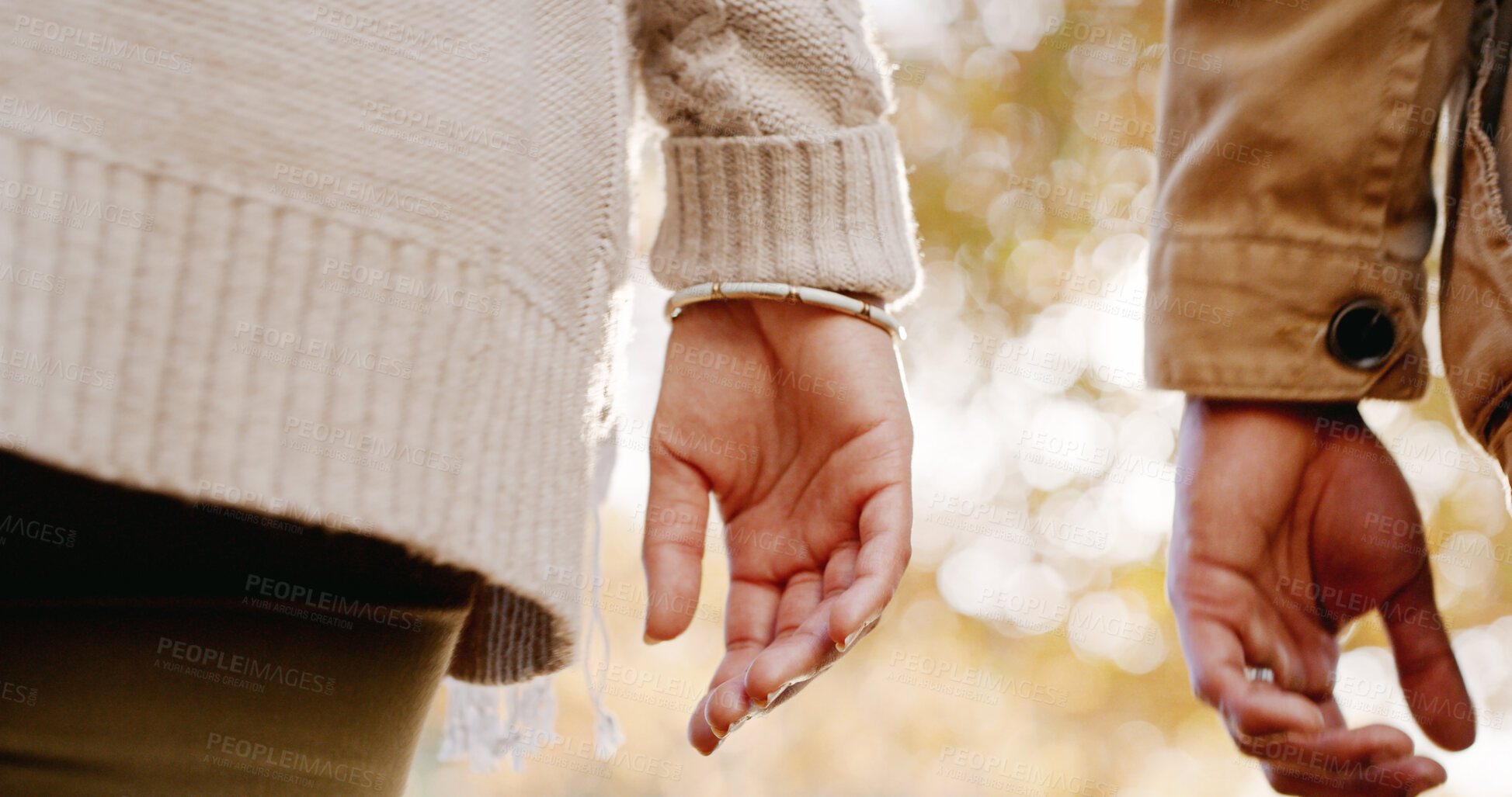 Buy stock photo Couple, outdoor and hands in park with walk, leaves and autumn in nature with people on vacation. Fall, holiday and hike in forest, woods and trees with journey, support and care together with love