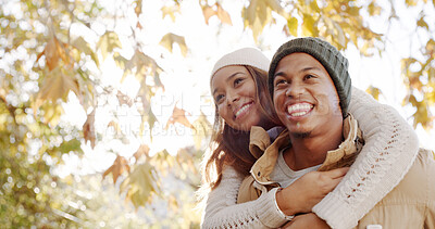 Buy stock photo Park, couple and smile on piggyback for bonding, love and support as lovers for trust. People, outdoor and happy on relationship in autumn for romance, care and affection together on valentines day