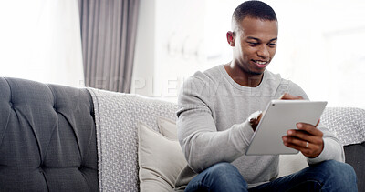 Buy stock photo House, typing and black man on sofa, tablet and connection with website info, relax and social media in lounge. African person, apartment and guy on couch, technology and communication with network