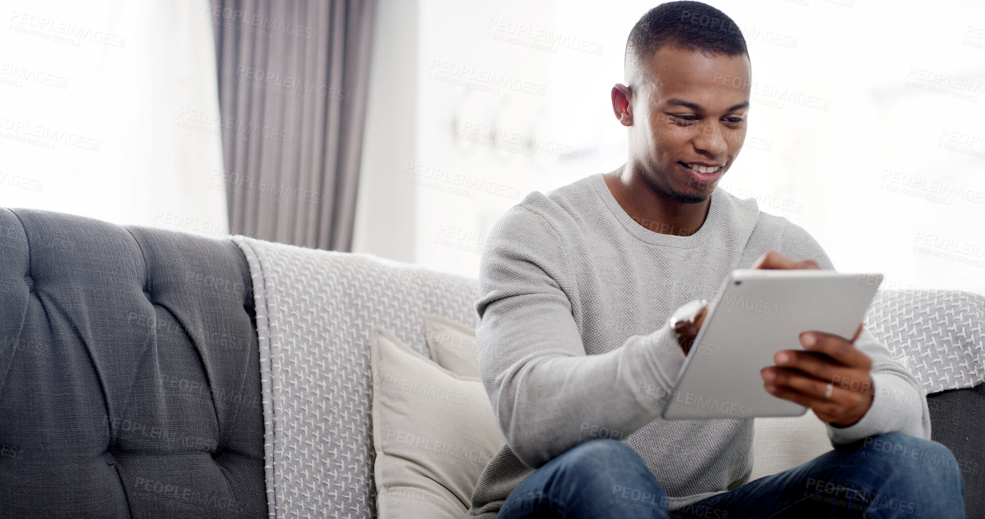 Buy stock photo House, typing and black man on sofa, tablet and connection with website info, relax and social media in lounge. African person, apartment and guy on couch, technology and communication with network