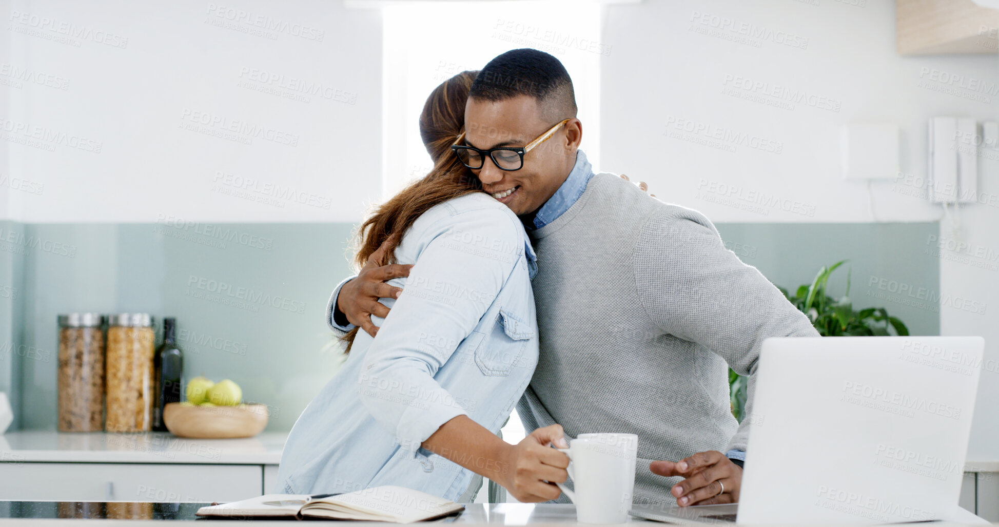 Buy stock photo Hug, laptop and couple in kitchen with coffee in morning for greeting, love and bonding together. Happy, computer and wife embracing man with remote work for marriage connection with care at in home.