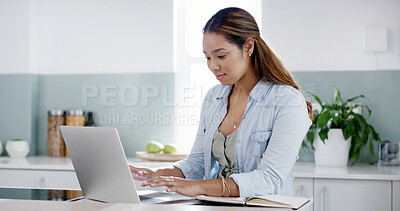 Buy stock photo Creative woman, home and laptop in kitchen thinking for social media, online ebook or networking. Freelancer, remote work and internet or research for entertainment, communication or copywriting