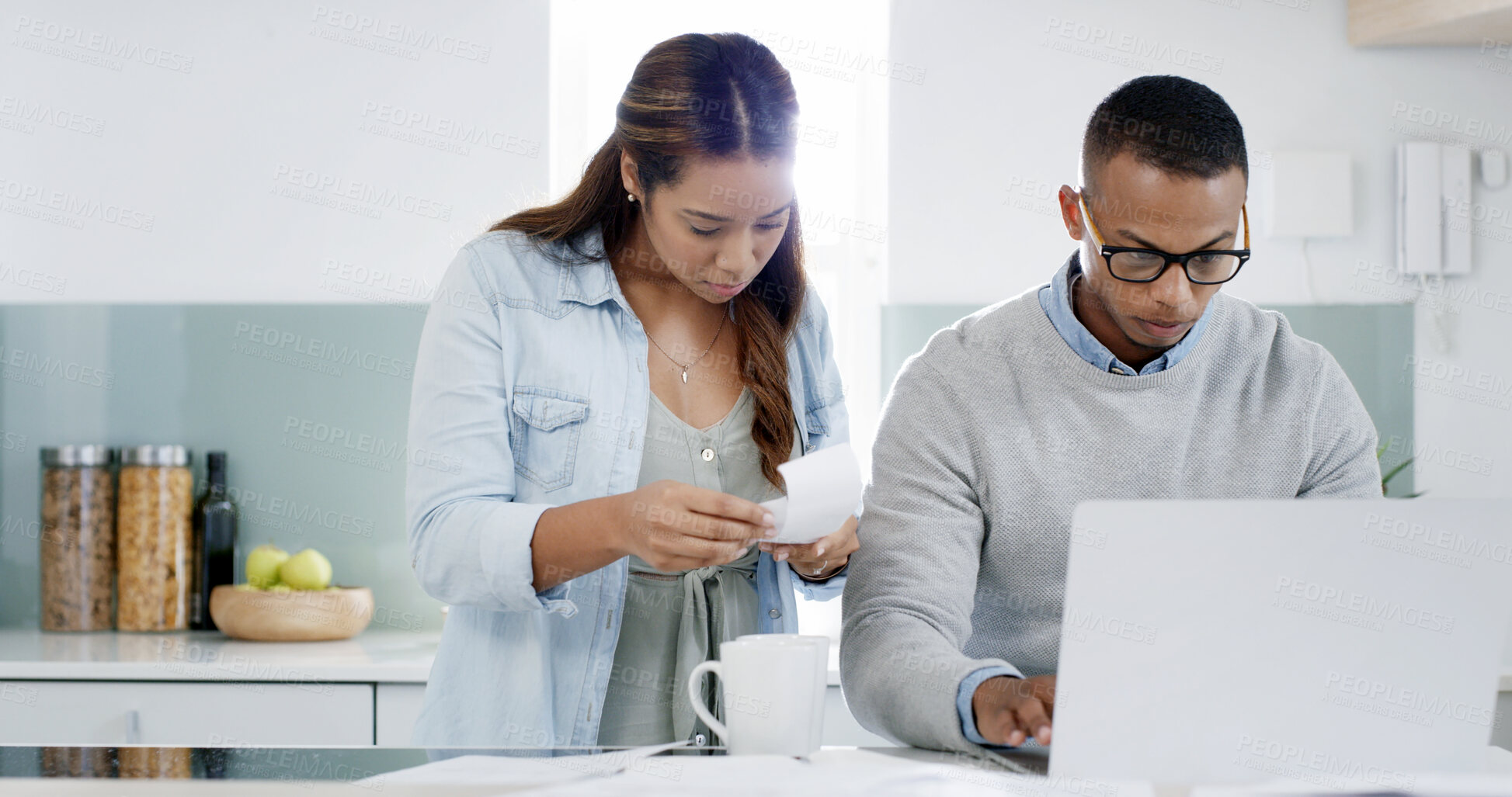 Buy stock photo Kitchen, reading and couple with laptop, morning and woman with receipt, bills and planning for payment. House, budget and review of purchase, taxes and tracking of expenses, man and analysis of info