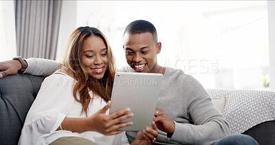 Buy stock photo Tablet, couch and African couple with video, streaming and website scroll in home. Living room, technology and watching funny series with comedy show or meme on internet with happy people and smile