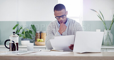 Buy stock photo Man, paper and thinking in kitchen for budget, planning and savings account with financial stress at tech. Person, glasses or invoice bills at table for home expenses, tax or anxiety for credit fraud