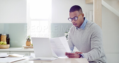 Buy stock photo Man, research and paperwork in kitchen for mortgage review, insurance documents and bills in home. Guy, computer and check documents with asset management, tax registration and budget spreadsheet