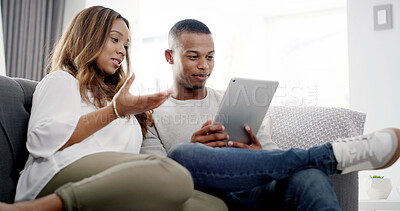 Buy stock photo Couple, planning and relax in living room with tablet, streaming subscription and social media news in home. Man, woman and technology on sofa for ecommerce, travel booking and choosing accommodation