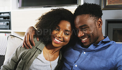 Buy stock photo Couple, home and happy with hug on sofa for bonding, support and care as lovers. Apartment, African people and smile on couch in living room for affection, trust and break for funny conversation