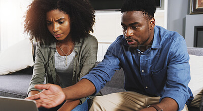 Buy stock photo Black couple, laptop and debt with stress for argument, financial crisis or disagreement on sofa at home. Young African, man and woman with computer for missed payment, conflict or fight at house