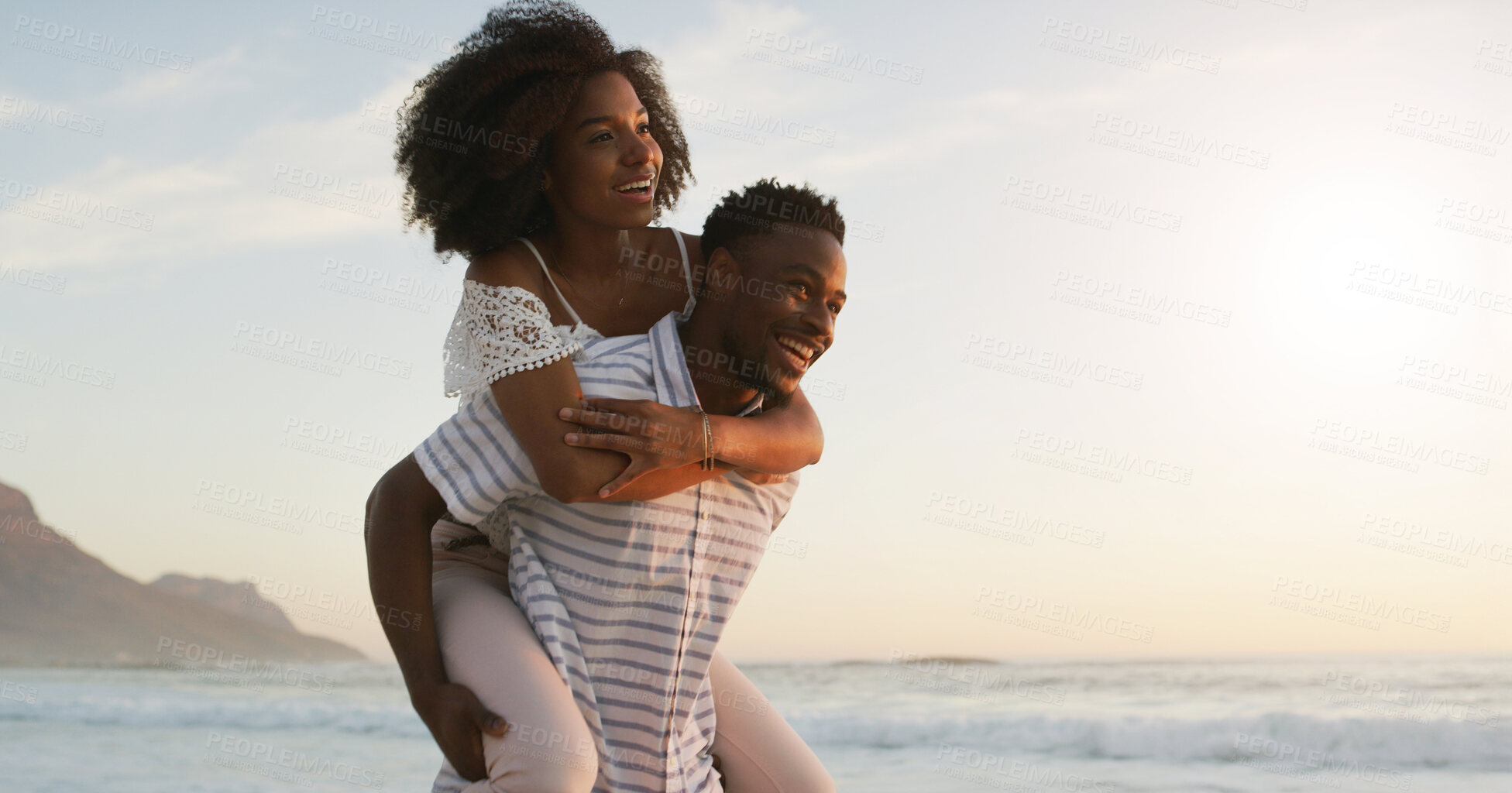 Buy stock photo Beach, couple and smile with piggyback on holiday for romance, date and bonding in Mauritius. Ocean, African people and happy in relationship on vacation or break for support, care and valentines day